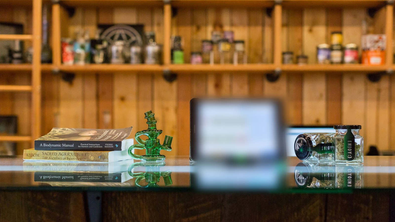 POS tablet on a dispensary sales counter, part of a connected cannabis marketing tech stack.